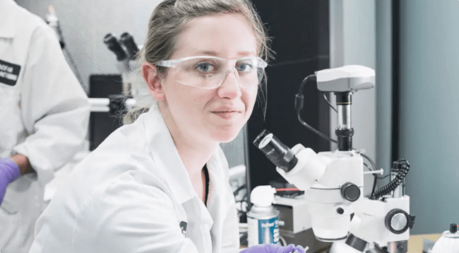 woman with protective glasses and gloves in the laboratory